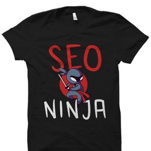May include Black t shirt with white text that rea